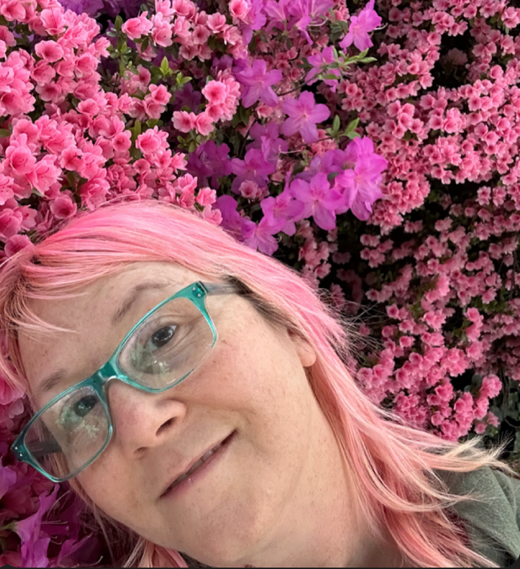 Spoon Popkin with pink hair on pink azaleas